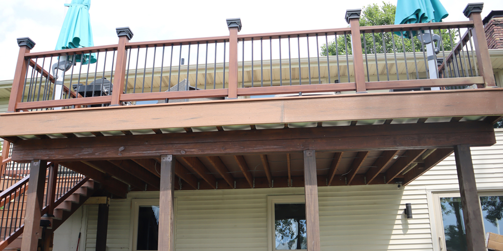 Exposed joists beneath a deck before installation