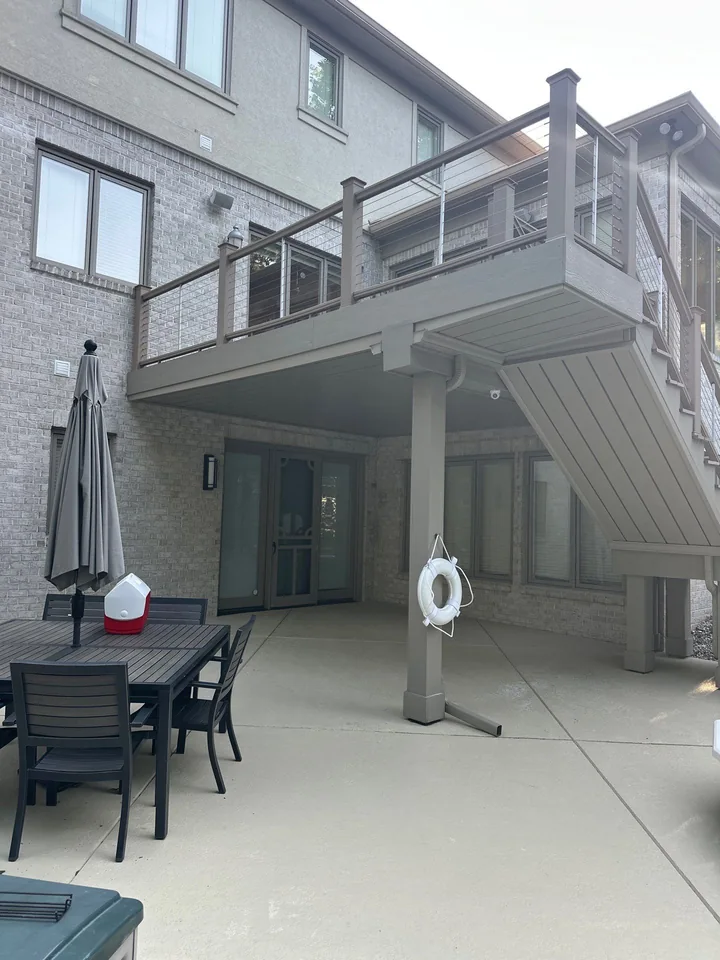 Finished outdoor living area beneath an existing elevated deck