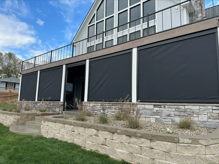 Finished screened-in space beneath an elevated deck