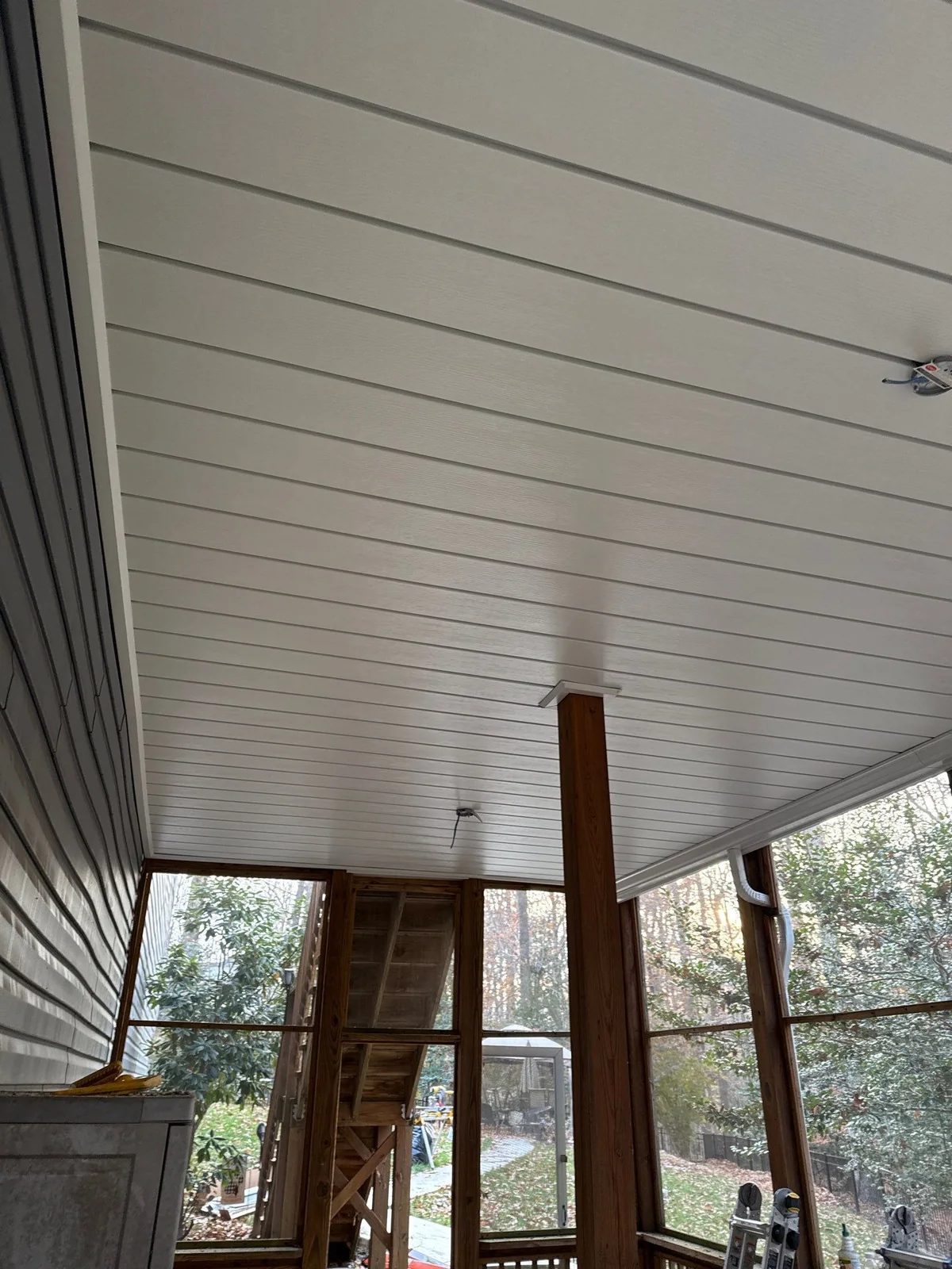Finished ceiling inside a screened under-deck space