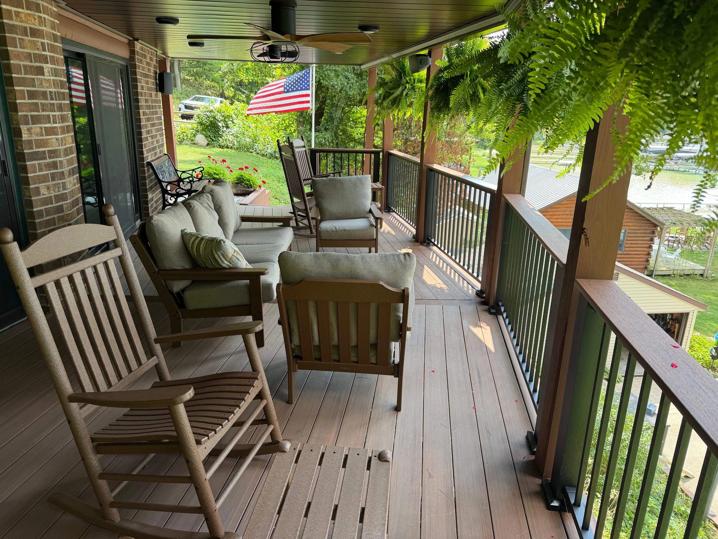 Furnished lakefront gathering area beneath the deck