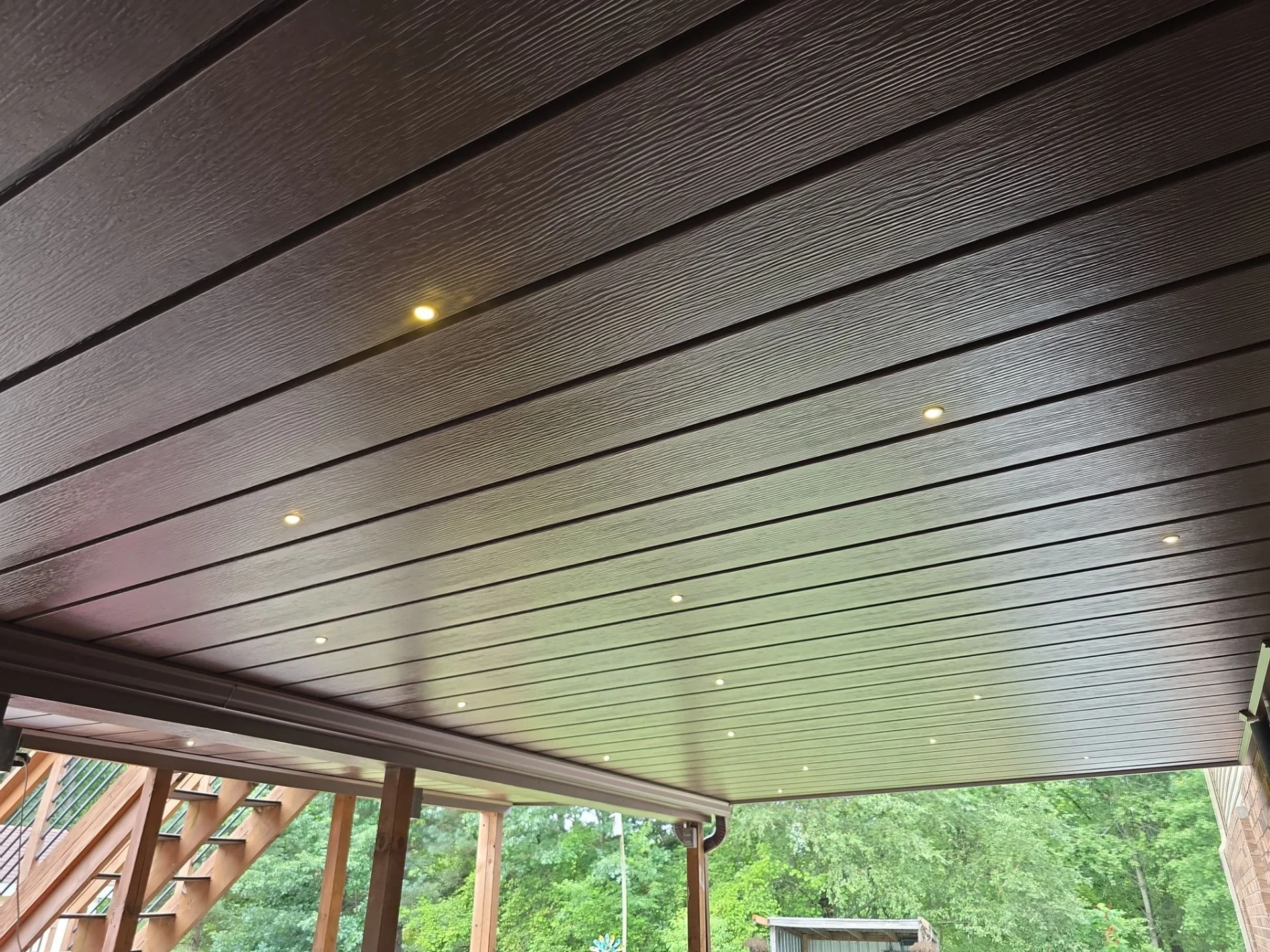 Close view of individual Starlights set into rustic brown ceiling panels