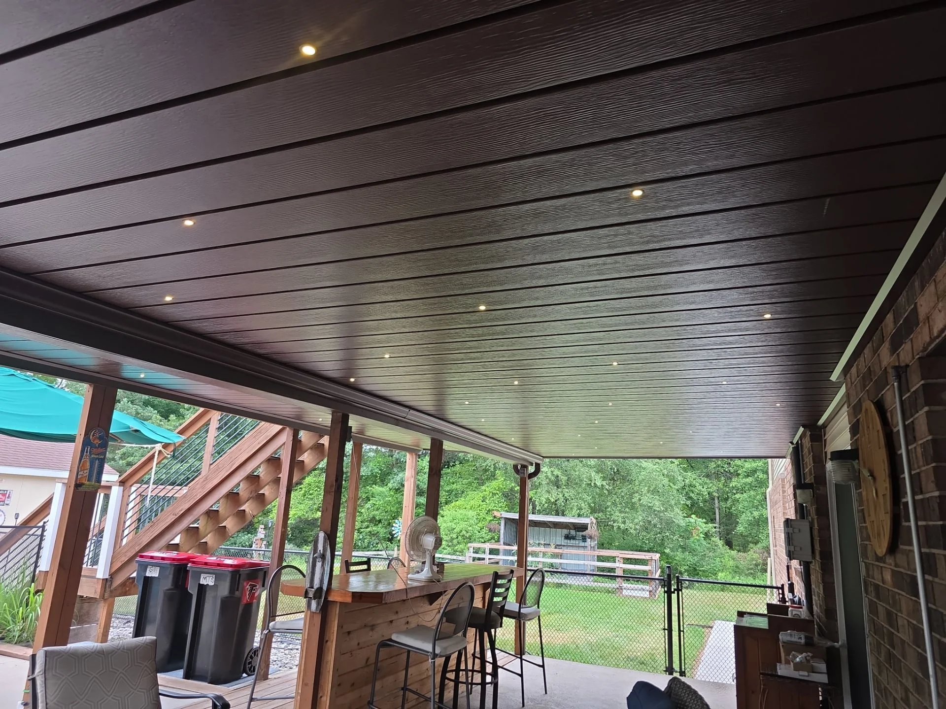 A broad field of Starlights integrated across dark aluminum ceiling panels