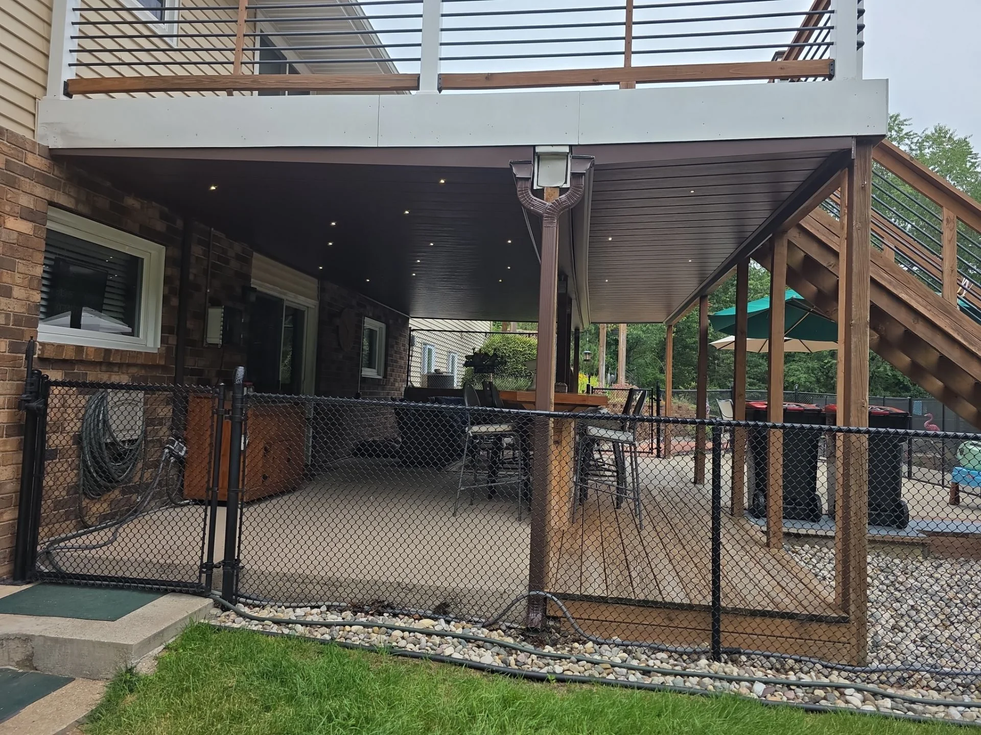 Wide exterior view of Starlights integrated beneath two connected deck areas